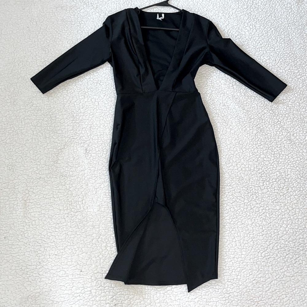 Black, Low-Cut Dress. Perfect for girls night, date night or just to feel sexy